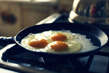 Eggs fry in a frying pan