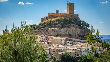 Fototapeta na wymiar Biar castle at top of hill over town, Alicante, Spain