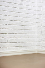 white brick wall with tiled floor and corner, abstract background photo