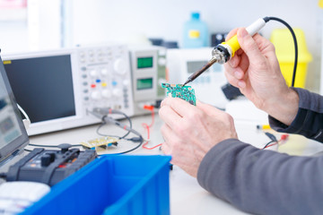 repair electronics device in laboratory