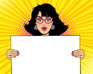 Wow female face. Young sexy surprised woman with open mouth in glasses holding blank board for your text. Vector colorful illustration in retro comic pop art style. Party invitation background. - 159816955