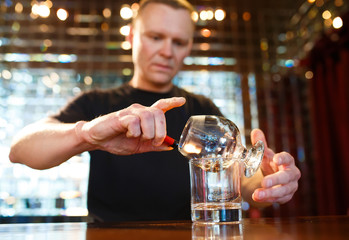 bartender burning Sambuca at the bar
