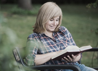 woman reading outdoors