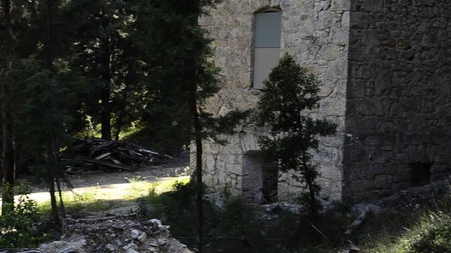 Corner stone, abandoned ruined stone house in the forest, clearing in the forest.mov