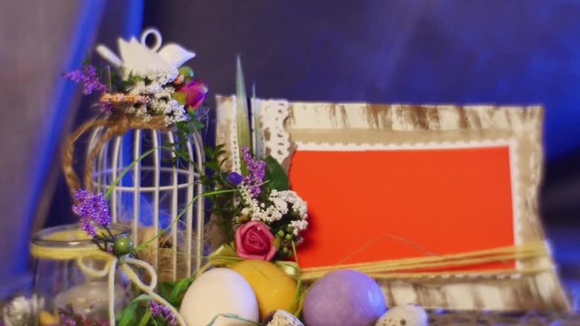 Hand Made Wooden Photo Frames Are Put on a Table, Covered With Easter Catholic Decor Including Colored Hen and Quail Eggs.