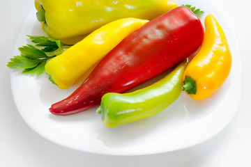 Whole red and yellow pepper. Raw vegetables. Long type.