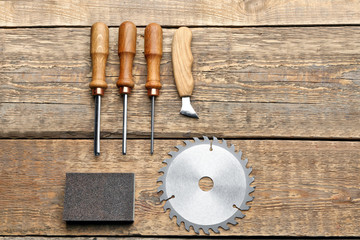 Fototapeta na wymiar Set of carpenter's tools on wooden background