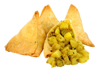 Punjabi style vegetable samosas isolated on a white background © philip kinsey