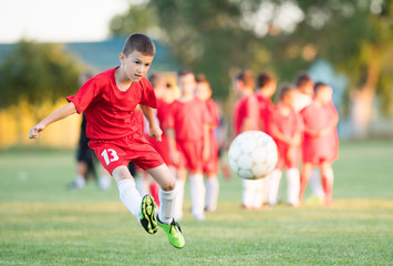 Kids soccer football - children players match on soccer field © Dusan Kostic