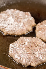 Frying meatballs of minced meat in the frying pan on the oil