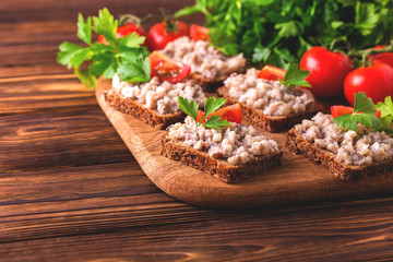 Toast with kosher Forshmak paste, parsley and cherry tomatoes