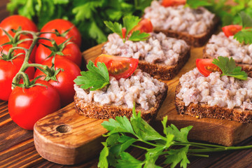 Toast with kosher Forshmak paste, parsley and cherry tomatoes