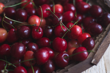 Cherry berries are fresh on a wooden background. Concept of health.