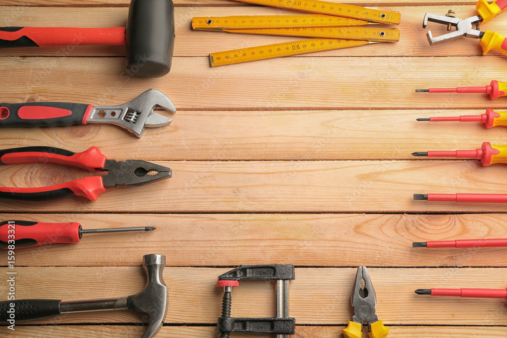 Wall mural Set of carpenter's tools with place for text on wooden table