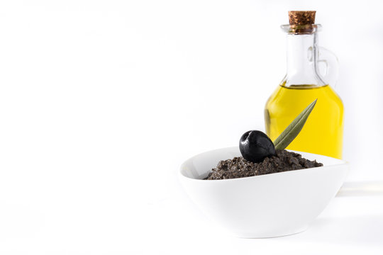 Black olive tapenade with anchovies, garlic and olive oil isolated on white background

