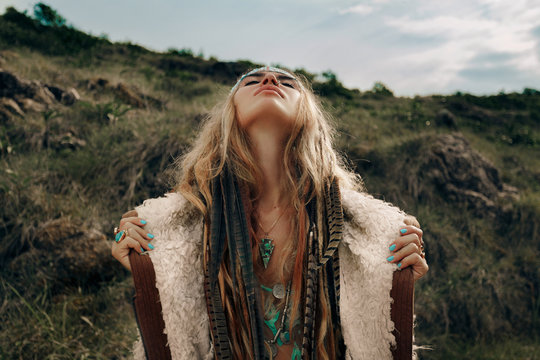 beautiful young boho girl in jacket look in the sky
