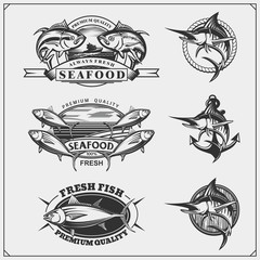 Fototapeta premium Fishing labels, badges, emblems and design elements. Illustrations of Tuna and Marlin.