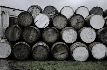 wooden barrels at the distiiery - 159842373
