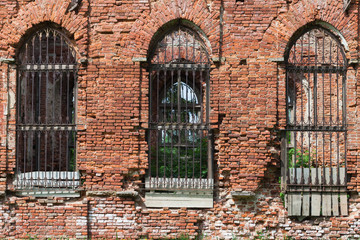 Fototapeta na wymiar Abandoned church wall with empty windows