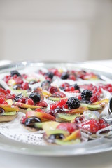 wedding catering on silver plates. small fruits on silver tray
