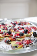 wedding catering on silver plates. small fruits on silver tray