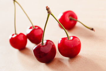 Ripe cherries on a light background