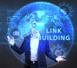 The concept of business, technology, the Internet and the network. A young entrepreneur working on a virtual screen of the future and sees the inscription: Link building