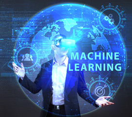 The concept of business, technology, the Internet and the network. A young entrepreneur working on a virtual screen of the future and sees the inscription: Machine learning