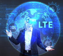 The concept of business, technology, the Internet and the network. A young entrepreneur working on a virtual screen of the future and sees the inscription: LTE