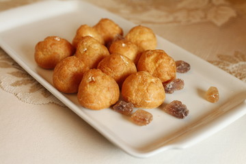 traditional carnival food served on a white plate with candy cane