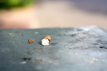 Last cigarette lies on a trash can