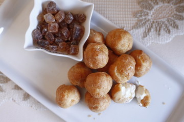 traditional carnival food served on a white plate with candy cane