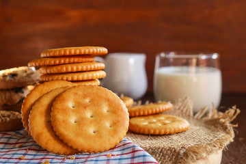 butter biscuits cracker and milk set up on napkin and wooden background