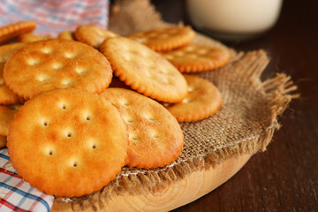 butter biscuits cracker and milk set up on napkin and wooden background