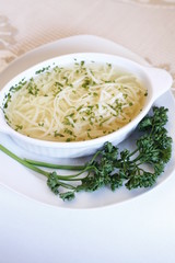 Delicious wedding soup in a white plate from above isolated