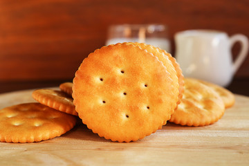 butter biscuits cracker and milk set up on wooden background