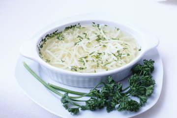 Delicious wedding soup in a white plate from above isolated