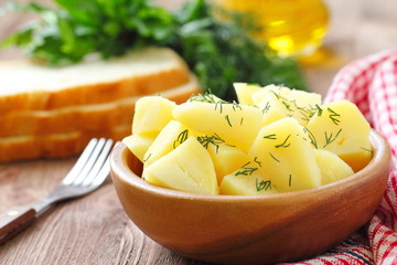 Boiled potatoes with dill and oil