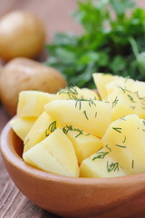 Boiled potatoes with dill and oil