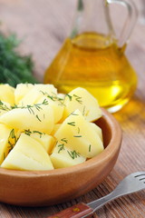 Boiled potatoes with dill and oil