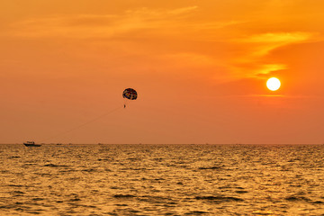 Parasailing during sunset at Langkawi island in Malaysia