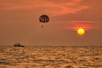 Parasailing during sunset at Langkawi island in Malaysia