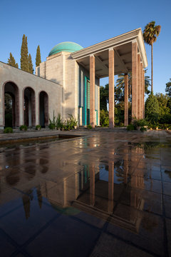 Tomb of Saadi in Shiraz Reflected on Wet Floor on a Sunny Day