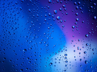 Water drops color background rain glass space rainbow.
