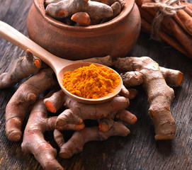 Turmeric ,Curcuma powder on table wooden