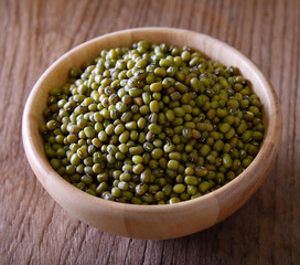 Green beans wooden bowls on table