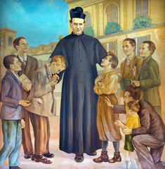 TURIN, ITALY - MARCH 15, 2017: The painting of Saint Don Bosco in the middle of his boys in church Basilica Maria Ausiliatrice by Paolo Giovanni Crida (20 cent.).