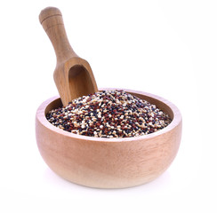 Quinoa seeds in wood bowl on white background