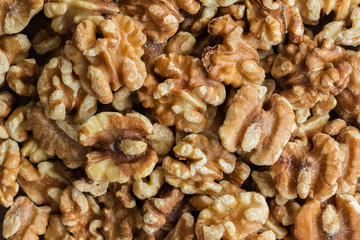 Baked walnuts for snack and bakery. Walnuts is good for health, diet food, raw material or ingredients for cooking and food. Natural tone,macro concept for background. Close up on baked walnuts.