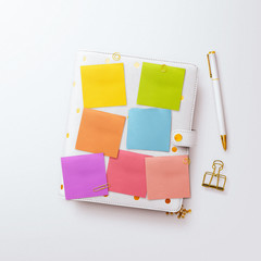 Desktop flatlay hero image, with gold feminine accessories and pink peony flower on a plain white...